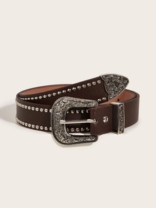 Detail of a brown leather punk belt featuring ornate silver buckles and metal rivets