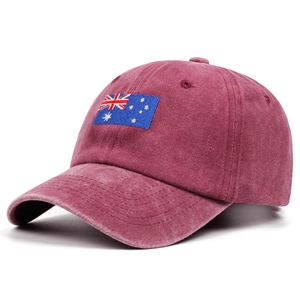 Detail of burgundy washed cotton baseball cap with embroidered Australia flag and retro finish