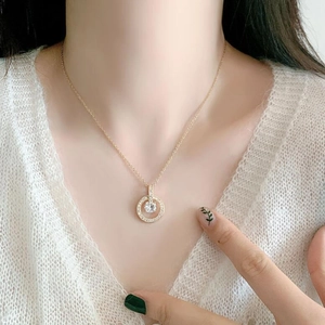 Exquisite gold stainless steel double ring pendant necklace with crystals on model