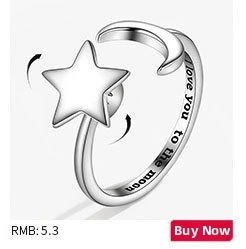 Detail of rotating ring band with Moon and Star design and I love you to the moon engraving