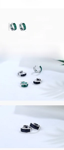 Macro view of S925 sterling silver hoop earrings with faceted green agate inlay