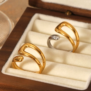 Minimalist bicolor open wrap rings in gold and silver finish on a premium jewelry box