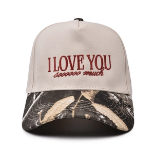 Macro detail of red I Love You sooooo much embroidery on a leopard print baseball cap