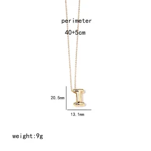 Detail view of gold letter I pendant necklace with dimensions 20.5mm height and 9g weight