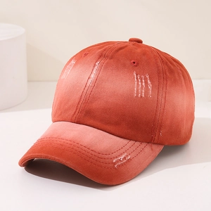 Close-up of distressed vintage cotton texture on orange gradient baseball cap for kids
