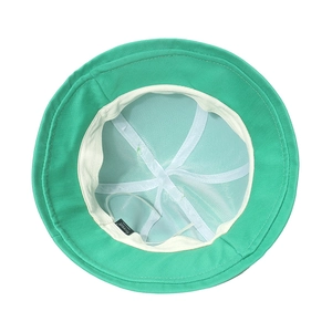 Internal view of green bucket hat with white mesh lining and soft sweatband detail