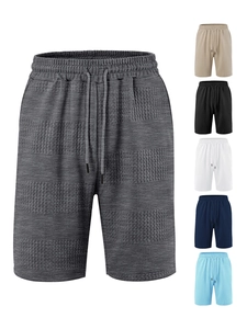 Detail of waffle knit fabric on men's striped shorts showing multi-color options