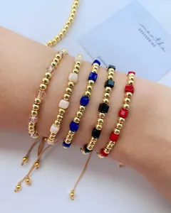 Detailed view of colorful square crystal beaded bracelets with adjustable gold-plated chains