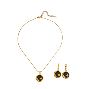 Parure collier et boucles d'oreilles soleil et lune en acier doré et émail noir