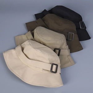 Detail of multi-color bucket hats with stylish metal buckle and twill cotton texture