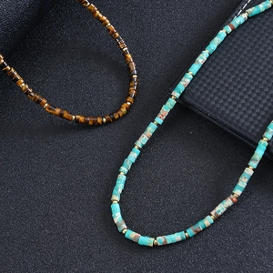 Bohemian beaded necklace featuring turquoise and amethyst stones with gold metal spacers