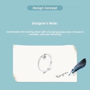 Detail of 925 sterling silver ring featuring a movable cute dog paw charm pendant
