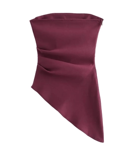Detail of burgundy strapless top with asymmetrical hem and ruched side zipper closure