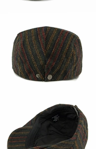 Detailed view of wool blend herringbone flat cap with metal buckle and internal wash labels
