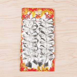 Set of 12 silver glitter Christmas bows for tree decoration on festive card display