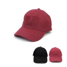 Close-up of baseball cap with American flag embroidery in burgundy, black and pink