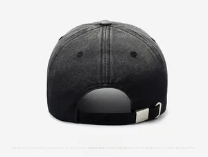 Detail of the vintage washed black baseball cap showing the adjustable metal buckle closure
