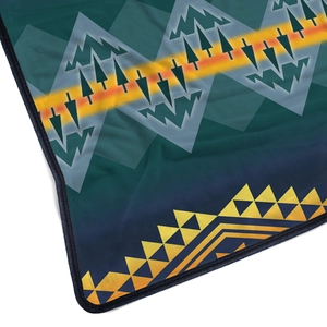 Detail of soft flannel blanket with ethnic geometric patterns and durable hemmed edges
