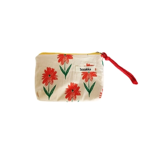 Canvas lipstick pouch with red floral pattern and yellow zipper for makeup storage