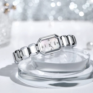 Women's octagonal silver watch with mother-of-pearl dial and diamond accents on a chain strap