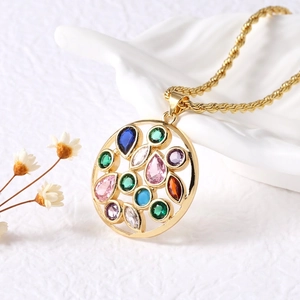 Gold circular pendant necklace with colorful gemstones on textured twist rope chain