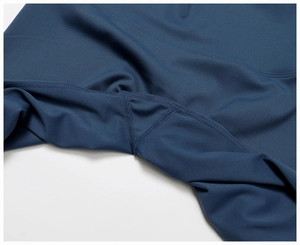 Detail of high-waisted yoga pants showing reinforced crotch gusset and flatlock stitching