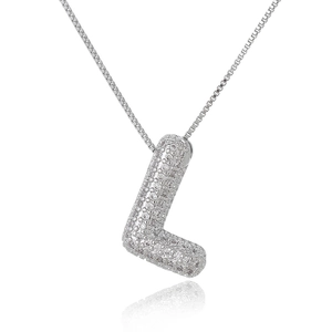 Close-up of silver letter L pendant with micro-pave zircons on a delicate box chain