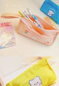 Detail of large capacity canvas pencil case with cute cartoon prints and side pocket