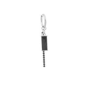 Detail of silver hoop earring with black rectangular gemstone and zircon chain fringe