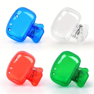 Grid view of four colorful translucent plastic hair claw clips in blue, red, green and clear
