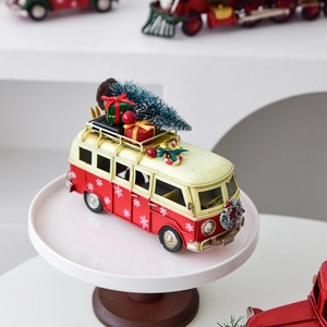 Vintage red and white metal Christmas van model with small tree and gift box decor