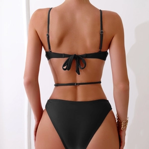 Back view of black two-piece bikini with lace-up bow and high-cut swimsuit design