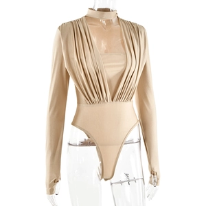 Detail of khaki long sleeve bodysuit showing deep V-neckline and pleated chest design