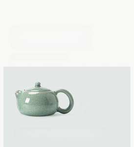 Close-up of celadon Ru Kiln Xishi teapot with distinct ice crackle glaze patterns