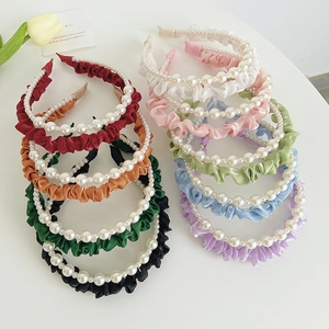 Collection of silk pleated headbands with pearls in nine vibrant colors for women