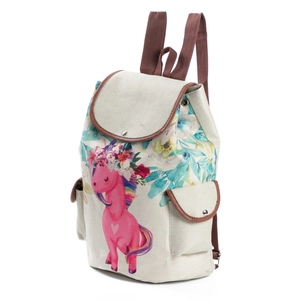 Detailed close-up showing the canvas texture and unicorn pattern on the travel backpack