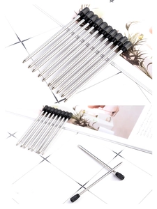 Detailed view of ten 70mm silver metal ballpoint pen refills with black plastic caps