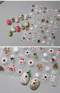 Close-up of 3D embossed Christmas nail stickers with Santa Claus and reindeer designs