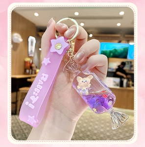 Purple rabbit liquid quicksand keychain with star silicone strap and gold metal hook