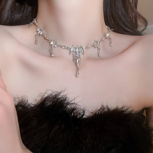 Close-up of hip hop silver tassel necklace with rhinestones worn on neck