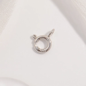 Macro shot of S925 sterling silver spring ring clasp with authentic hallmark for jewelry