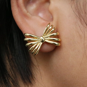 Elegant 18k gold plated copper bow earrings for women with polished metallic finish