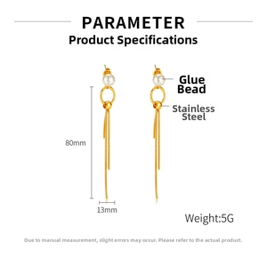 Detail view of 80mm long gold stainless steel tassel earrings with elegant pearl accents