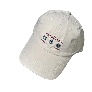 Cream white cotton baseball cap with embroidered lettering for a casual unisex style