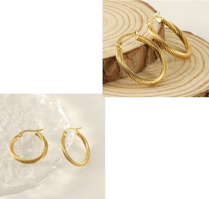 Detail of 18K gold-plated twisted rope hoop earrings with polished texture and metallic shine