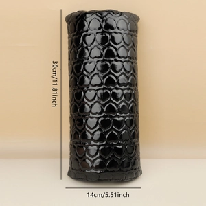 Detail of black heart-embossed PU leather manicure armrest pillow with 30x14cm size