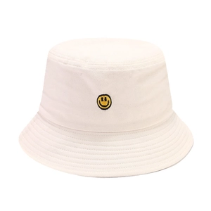 White canvas bucket hat with embroidered yellow smiley face for outdoor sun protection