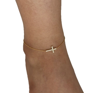 Minimalist gold stainless steel anklet featuring a small zircon inlaid cross pendant