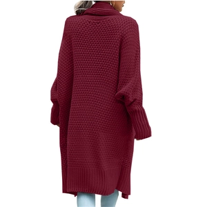 Detail view of burgundy long cardigan featuring chunky knit texture and batwing sleeves