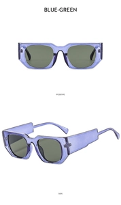 Detail view of stylish square purple translucent sunglasses with green lenses
